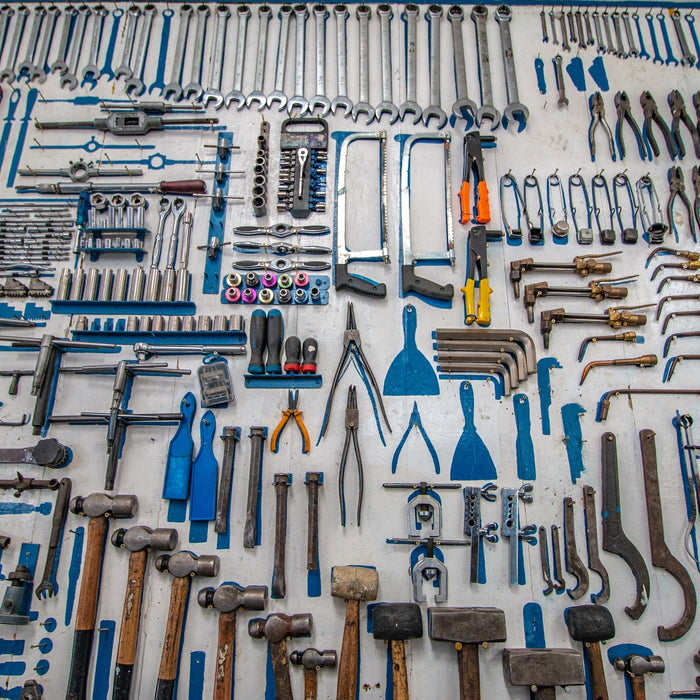 A collection of tools arranged on a table