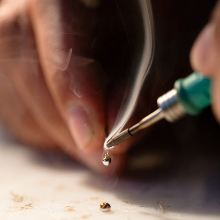 Image of a person doing soldering work
