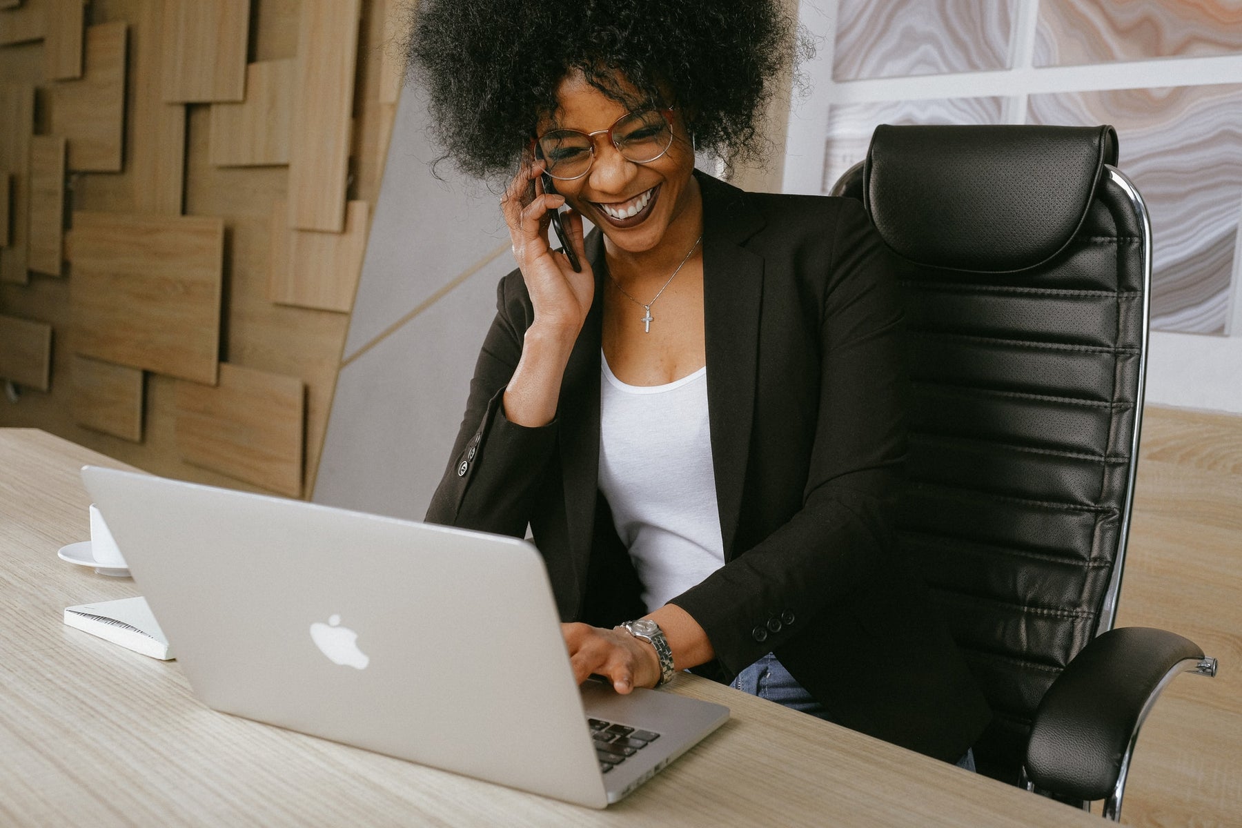 A woman comfortably sitting on an ESD safe ergonomic chair