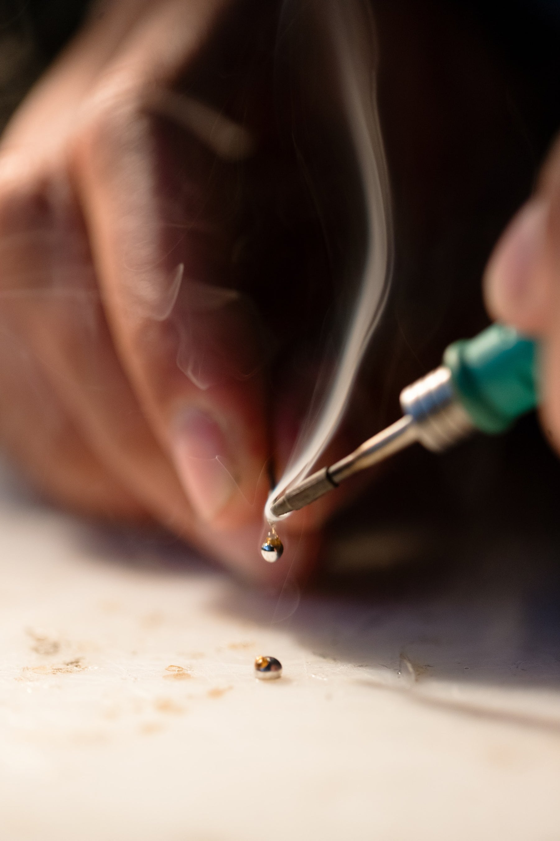 Image of a person soldering
